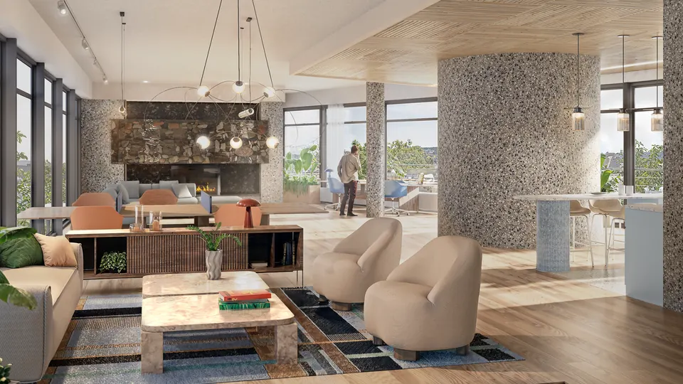 Lounge med terrazzosøyler, peis og lyse møbler